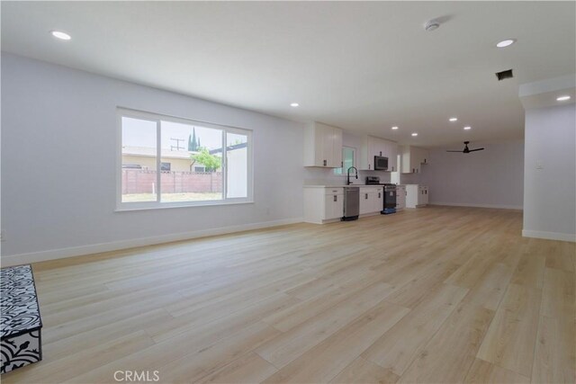 25411 Cottage Ave, Loma Linda, CA 92354 - unfurnished living room with light wood finished floors and recessed lighting
