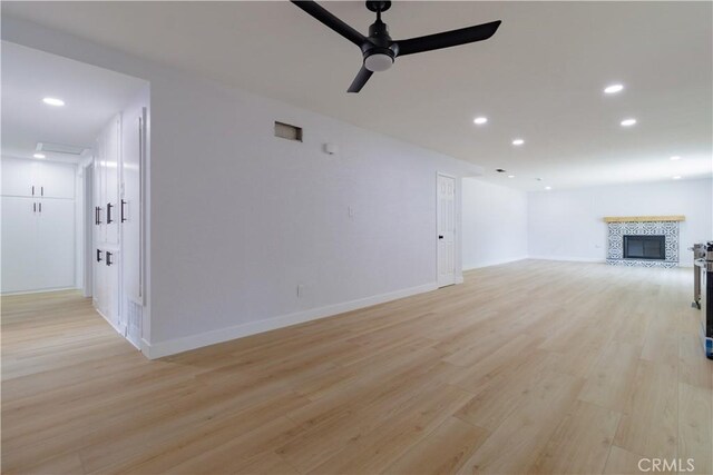 25411 Cottage Ave, Loma Linda, CA 92354 - unfurnished living room with recessed lighting, ceiling fan, light wood finished floors, and a fireplace