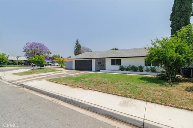 25411 Cottage Ave, Loma Linda, CA 92354 - ranch-style home featuring an attached garage, a front lawn, and concrete driveway