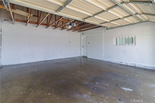 25411 Cottage Ave, Loma Linda, CA 92354 - garage featuring a garage door opener