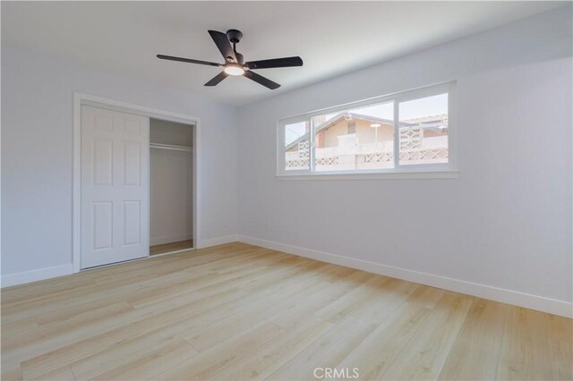 25411 Cottage Ave, Loma Linda, CA 92354 - unfurnished bedroom featuring wood finished floors, a closet, and a ceiling fan