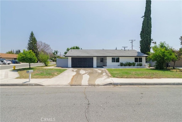 25411 Cottage Ave, Loma Linda, CA 92354 - ranch-style home with concrete driveway, a front lawn, and a garage