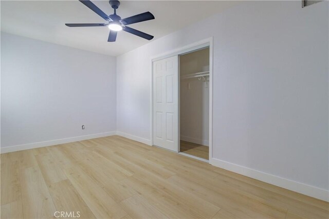 25411 Cottage Ave, Loma Linda, CA 92354 - unfurnished bedroom with light wood-style flooring, a closet, and a ceiling fan