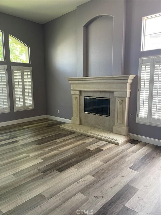 2431 Elizabeth Ct, Upland, CA 91784 - unfurnished living room with a fireplace and wood finished floors