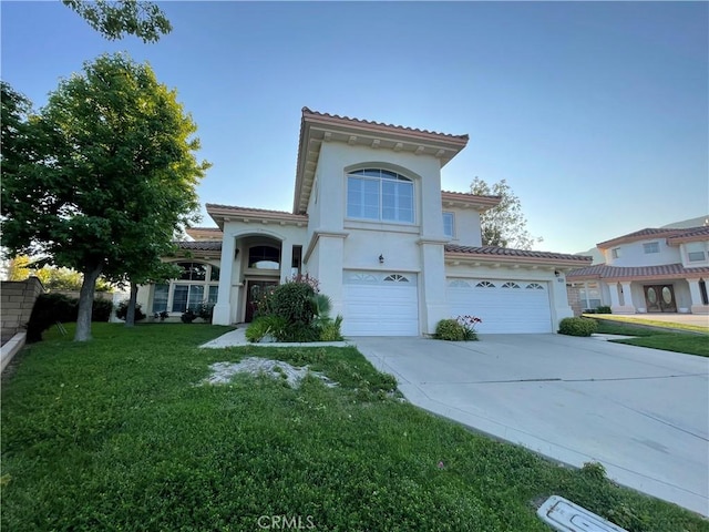 2431 Elizabeth Ct, Upland, CA 91784 - mediterranean / spanish-style house featuring a tiled roof, a front yard, and driveway