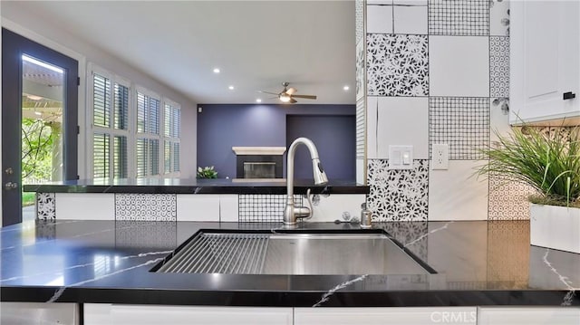 2431 Elizabeth Ct, Upland, CA 91784 - kitchen featuring ceiling fan, decorative backsplash, recessed lighting, white cabinets, and dark countertops