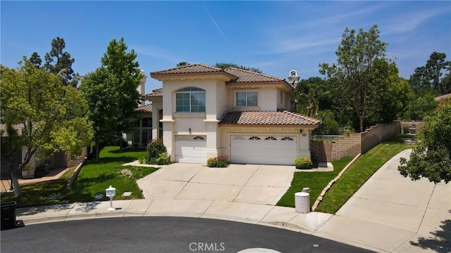 2431 Elizabeth Ct, Upland, CA 91784 - mediterranean / spanish-style house featuring stucco siding, an attached garage, concrete driveway, a tiled roof, and a chimney