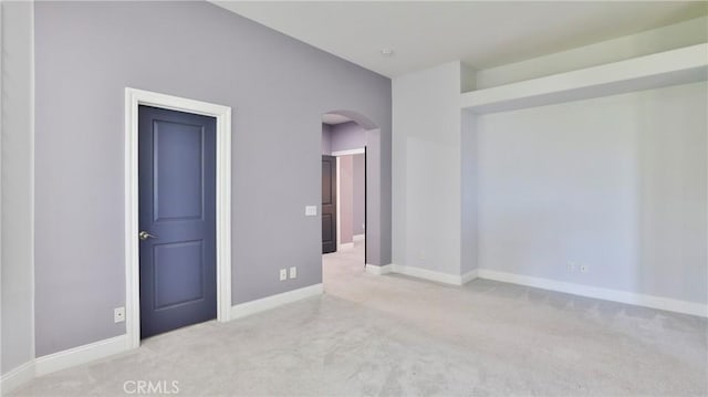 2431 Elizabeth Ct, Upland, CA 91784 - empty room with arched walkways and carpet