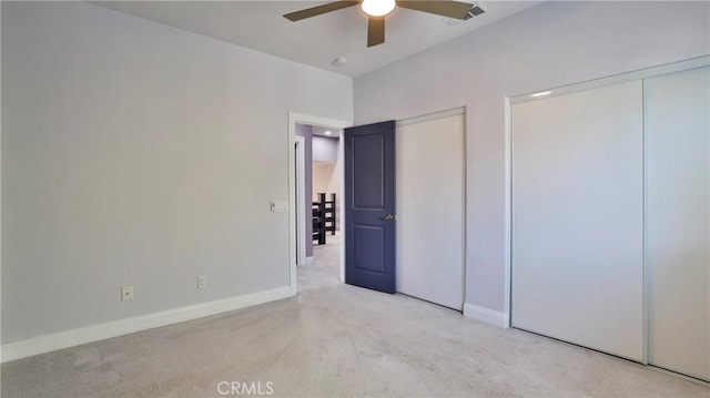 2431 Elizabeth Ct, Upland, CA 91784 - unfurnished bedroom with light colored carpet, multiple closets, and ceiling fan