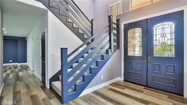 2431 Elizabeth Ct, Upland, CA 91784 - foyer entrance with wood finished floors and stairs