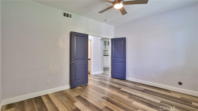 2431 Elizabeth Ct, Upland, CA 91784 - empty room with ceiling fan and wood finished floors