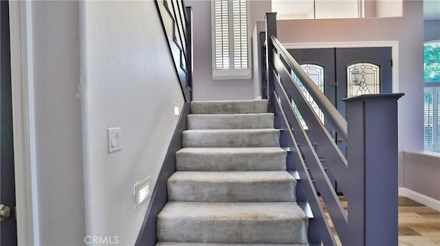 2431 Elizabeth Ct, Upland, CA 91784 - stairs with wood finished floors and baseboards