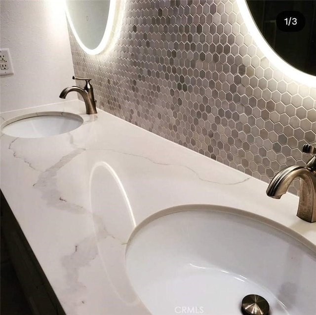 1447 Genoa Ln, San Jacinto, CA 92583 - bathroom with tasteful backsplash and double vanity