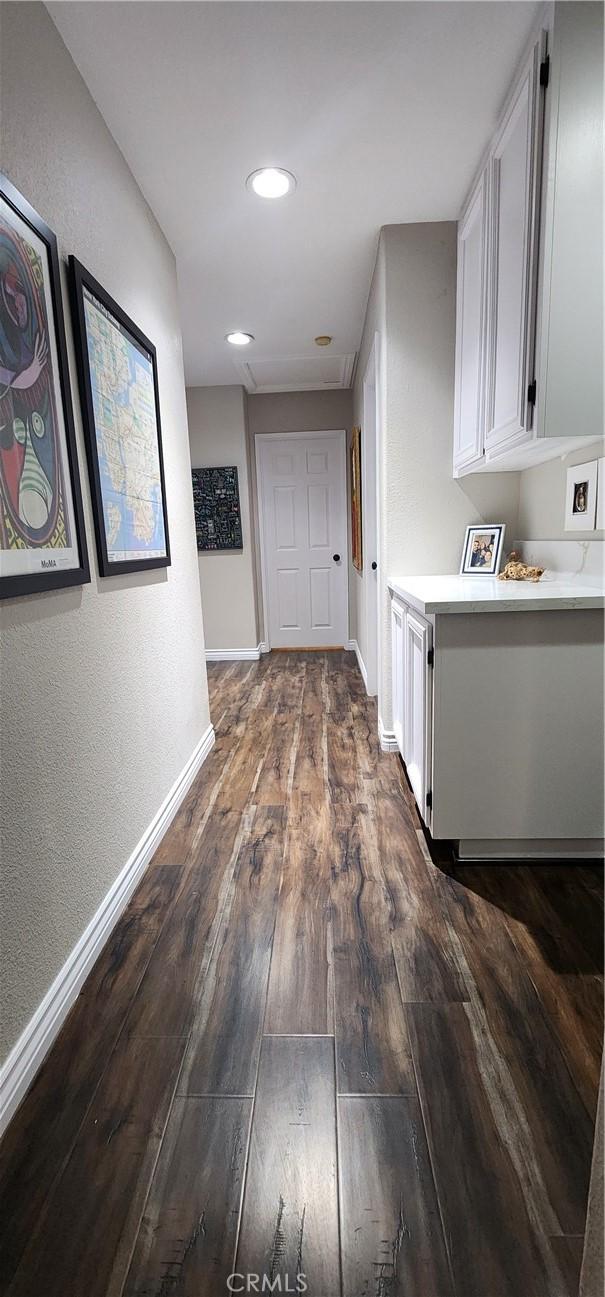 1447 Genoa Ln, San Jacinto, CA 92583 - hall featuring dark wood finished floors and recessed lighting