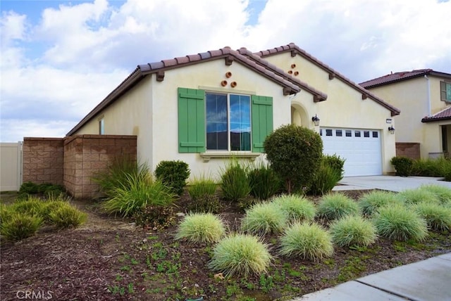 3042 Eveningcloud St, Hemet, CA 92543 - view of front facade featuring an attached garage, driveway, stucco siding, and a tile roof