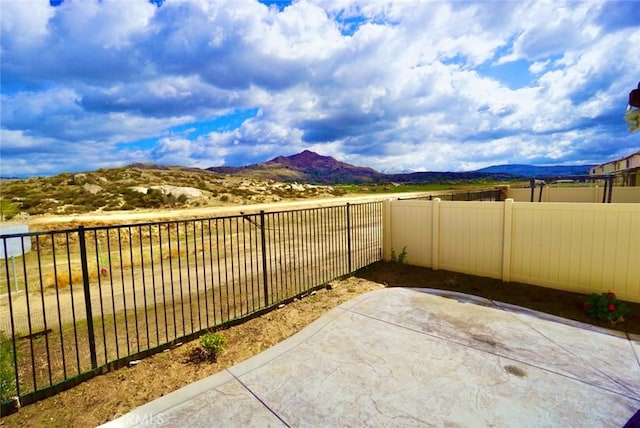 3042 Eveningcloud St, Hemet, CA 92543 - fenced backyard with a mountain view and a patio