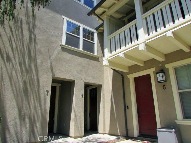 3981 E Emory Ln Unit 6, Ontario, CA 91761 - view of exterior entry featuring stucco siding and a balcony