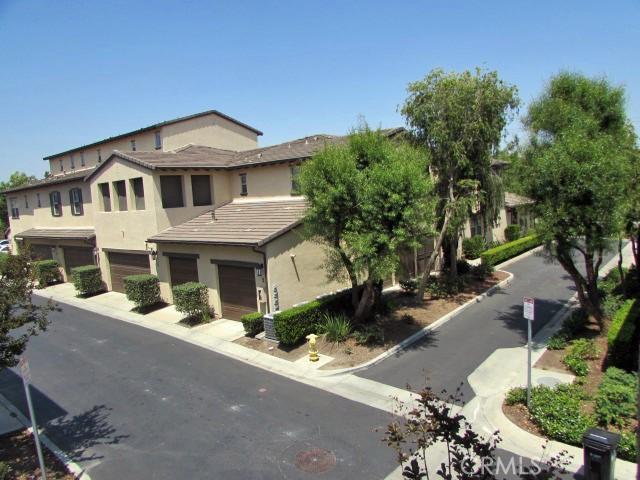 3981 E Emory Ln Unit 6, Ontario, CA 91761 - view of front of home with a garage and stucco siding