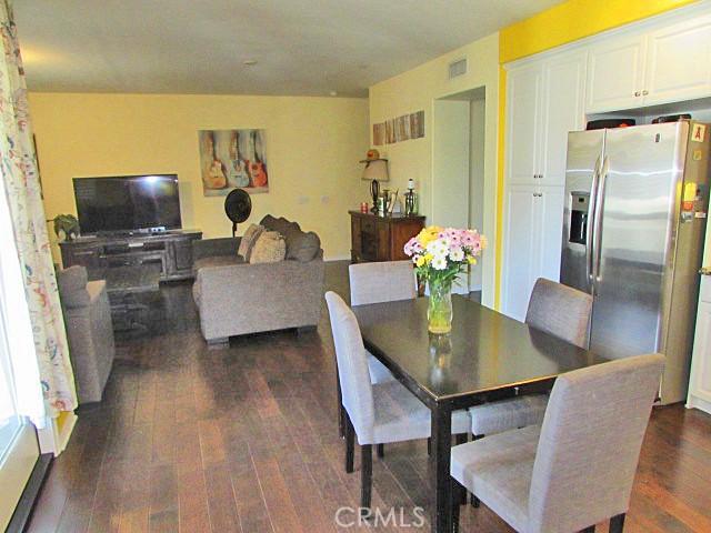 3981 E Emory Ln Unit 6, Ontario, CA 91761 - dining space with dark wood-style flooring