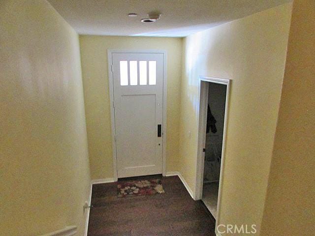 3981 E Emory Ln Unit 6, Ontario, CA 91761 - entryway featuring dark wood-style floors and baseboards