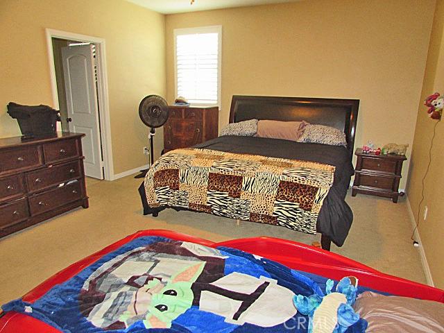 3981 E Emory Ln Unit 6, Ontario, CA 91761 - bedroom featuring carpet floors and baseboards