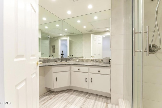 8857 Bluffdale Dr, Sun Valley, CA 91352 - full bath with a stall shower, double vanity, and recessed lighting