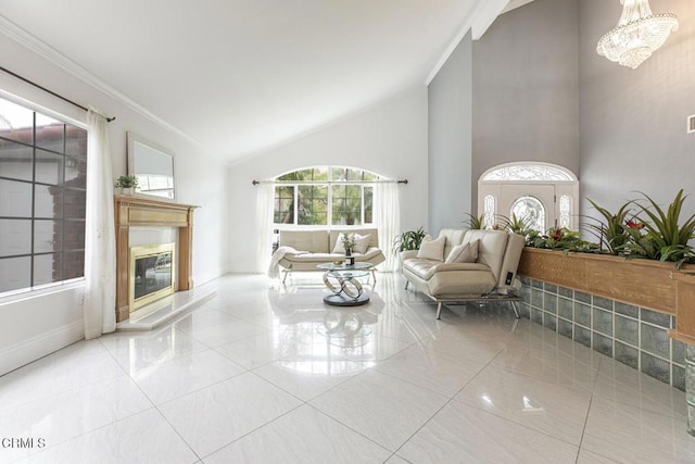 8857 Bluffdale Dr, Sun Valley, CA 91352 - living area with high vaulted ceiling, a glass covered fireplace, crown molding, tile patterned floors, and a chandelier