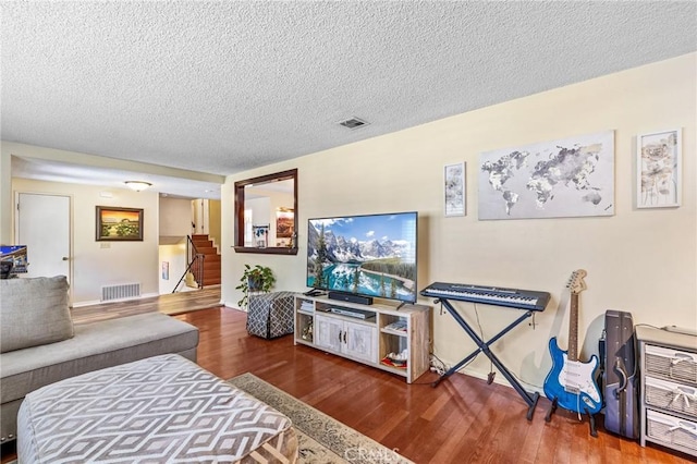 5644 Wadsworth Ave, Highland, CA 92346 - living area with wood finished floors, stairs, and a textured ceiling