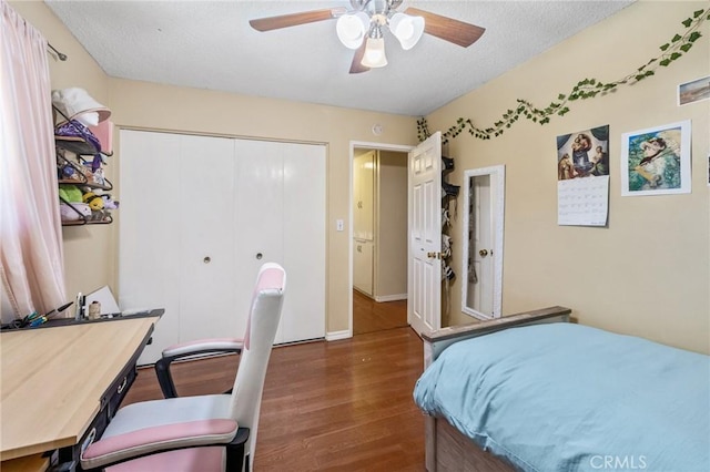 5644 Wadsworth Ave, Highland, CA 92346 - bedroom with wood finished floors, an office area, a closet, a textured ceiling, and a ceiling fan