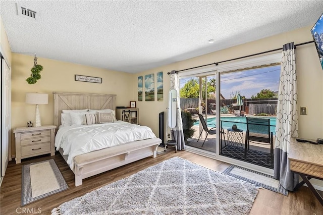 5644 Wadsworth Ave, Highland, CA 92346 - bedroom featuring access to outside, a textured ceiling, and wood finished floors
