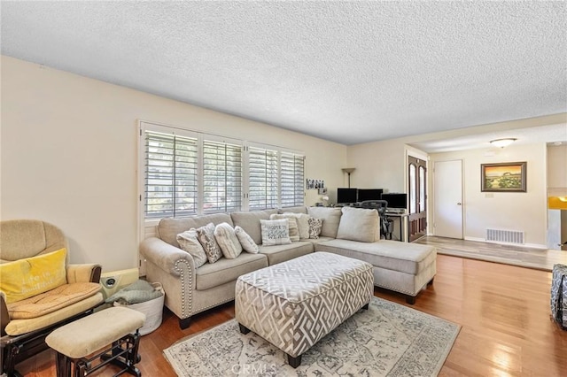 5644 Wadsworth Ave, Highland, CA 92346 - living area featuring wood finished floors and a textured ceiling