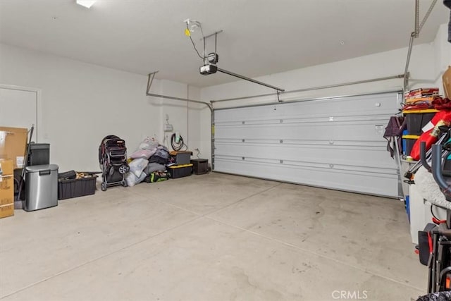 1023 Barberry Ln, Calimesa, CA 92320 - garage featuring a garage door opener