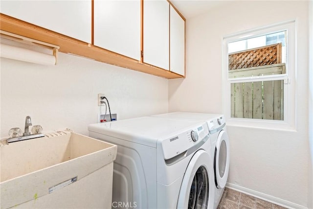 24101 Crowned Partridge Ln, Murrieta, CA 92562 - laundry area with cabinet space and washer and clothes dryer