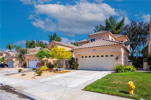 24101 Crowned Partridge Ln, Murrieta, CA 92562 - mediterranean / spanish home featuring stucco siding, a garage, driveway, a tile roof, and a front lawn