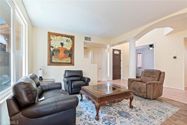 24101 Crowned Partridge Ln, Murrieta, CA 92562 - living area with ornate columns, wood finished floors, and ceiling fan