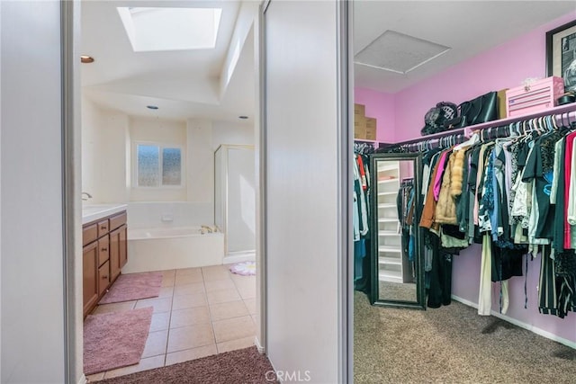 24101 Crowned Partridge Ln, Murrieta, CA 92562 - walk in closet featuring light tile patterned floors