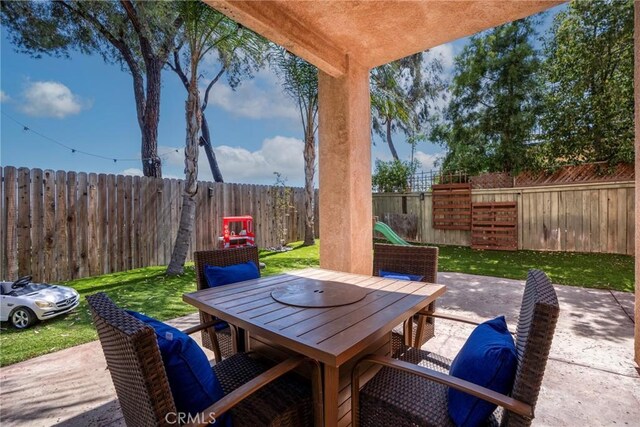 24101 Crowned Partridge Ln, Murrieta, CA 92562 - fenced backyard with outdoor dining space and a patio area