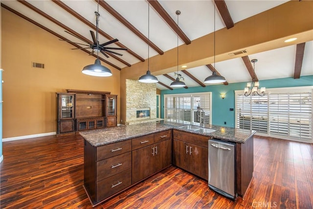 27470 Lakeview Dr, Helendale, CA 92342 - kitchen featuring beam ceiling, a fireplace, stainless steel dishwasher, a chandelier, and a sink