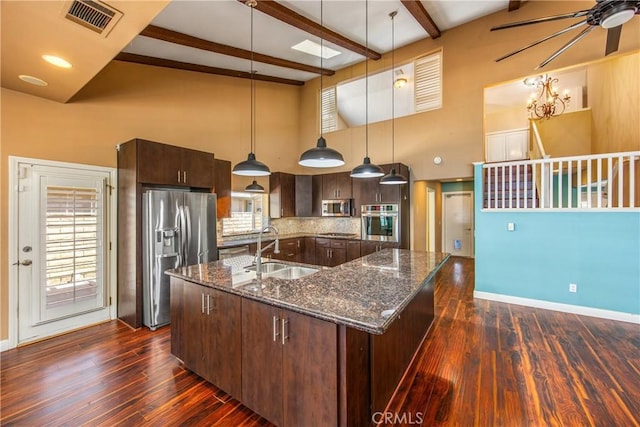 27470 Lakeview Dr, Helendale, CA 92342 - kitchen featuring stainless steel appliances, a sink, dark brown cabinetry, a towering ceiling, and dark wood finished floors