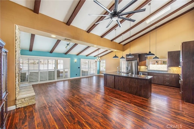 27470 Lakeview Dr, Helendale, CA 92342 - kitchen featuring appliances with stainless steel finishes, open floor plan, dark brown cabinets, beam ceiling, and dark wood-style floors