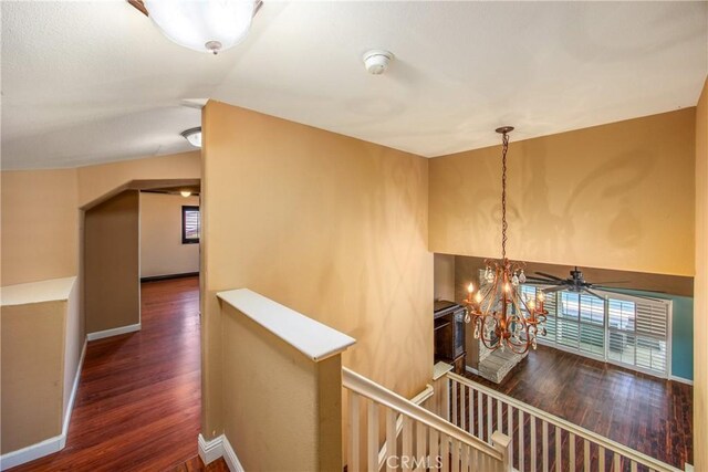 27470 Lakeview Dr, Helendale, CA 92342 - hall featuring an upstairs landing, wood finished floors, healthy amount of natural light, a chandelier, and lofted ceiling