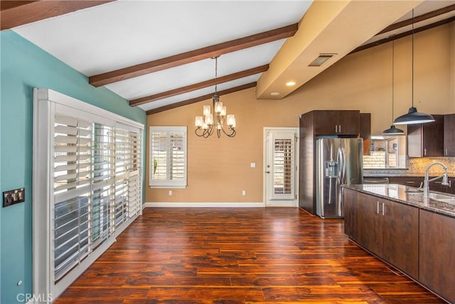 27470 Lakeview Dr, Helendale, CA 92342 - kitchen featuring stainless steel fridge with ice dispenser, dark stone counters, dark brown cabinetry, dark wood-type flooring, and a chandelier