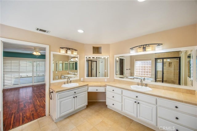 27470 Lakeview Dr, Helendale, CA 92342 - full bath featuring vanity, ceiling fan, tiled shower, recessed lighting, and tile patterned flooring