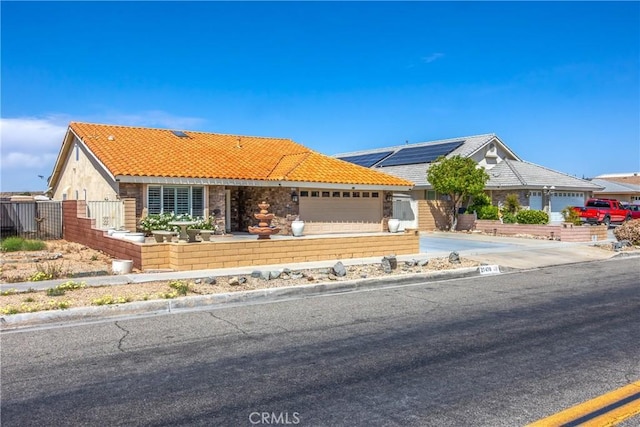 27470 Lakeview Dr, Helendale, CA 92342 - single story home with a tile roof, roof mounted solar panels, and a garage