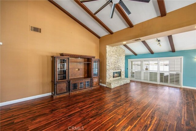 27470 Lakeview Dr, Helendale, CA 92342 - unfurnished living room with beam ceiling, ceiling fan, a stone fireplace, wood finished floors, and baseboards