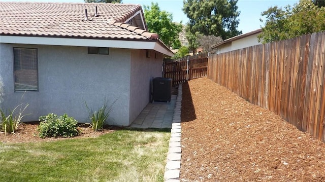 284 Celeste Dr, Riverside, CA 92507 - view of side of property featuring stucco siding and a tiled roof