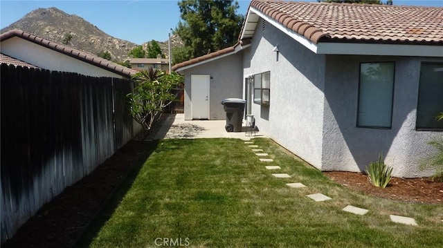 284 Celeste Dr, Riverside, CA 92507 - fenced backyard featuring a mountain view and a patio