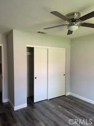 284 Celeste Dr, Riverside, CA 92507 - unfurnished bedroom with a closet, dark wood finished floors, and ceiling fan