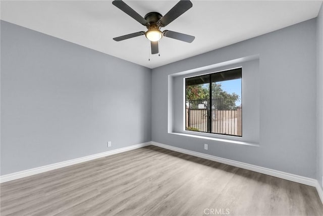 12830 Perris Blvd Unit C10, Moreno Valley, CA 92553 - empty room featuring wood finished floors, baseboards, and ceiling fan