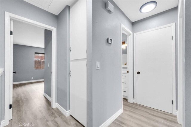 12830 Perris Blvd Unit C10, Moreno Valley, CA 92553 - hall featuring light wood finished floors and baseboards